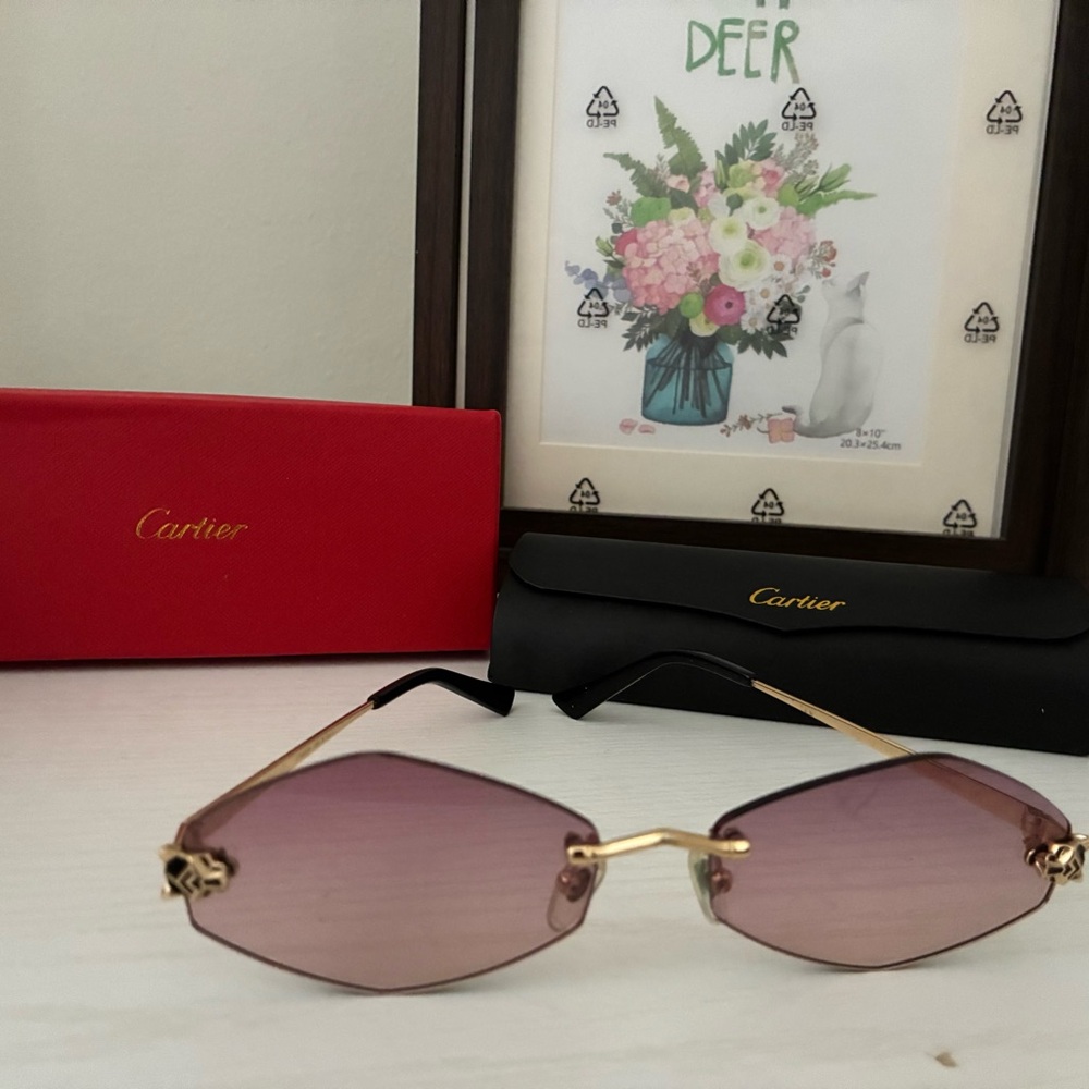 Cartier Women's Rimless Sunglasses with Purple Lenses and Gold Accents